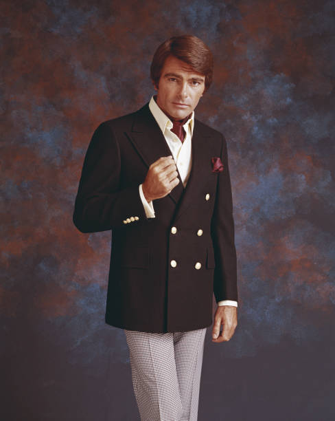 man in full suit standing against multi coloured background, portrait - 歸檔 圖片 個照片及圖片檔