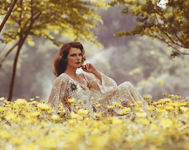 Woman sitting in garden, portrait  1974 photos stock pictures, royalty-free photos & images