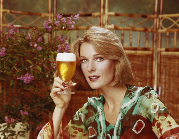 Mid adult woman holding beer glass, portrait, close-up  beer alcohol photos stock pictures, royalty-free photos & images