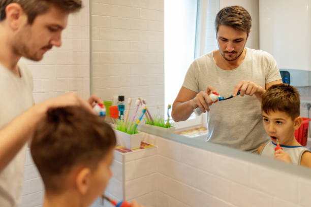 istock Father in bathroom with preparing to brush teeth 1196794170