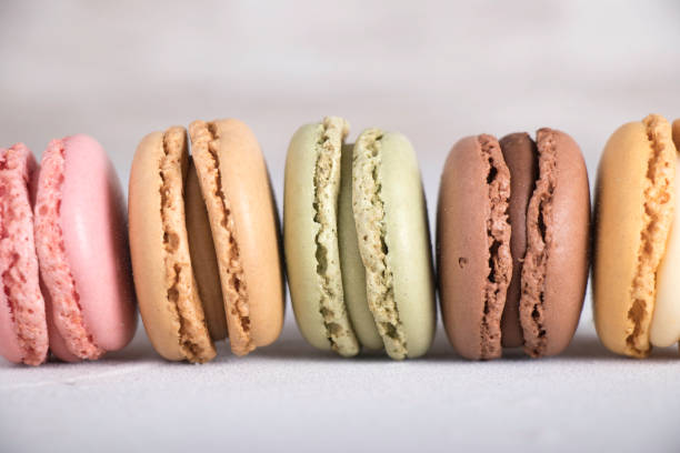 istock Colorful pastel macarons on gray background 1196797309