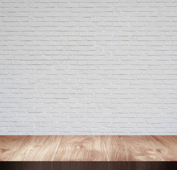 istock Wooden top board empty table in front of white wall 1196803179