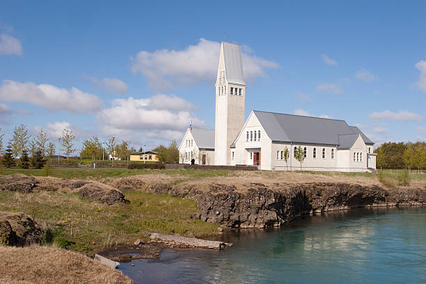 Landscape view of small village by fjord water river and mountains in small fishing town called Hofn in Iceland