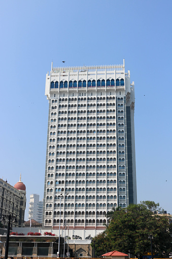 The Taj Mahal Tower is an additional wing of the Taj Mahal Palace Hotel, was opened in 1973. The Taj Mahal Palace Hotel, is a heritage, five-star, luxury hotel built in the Saracenic Revival style in the Colaba region of Mumbai, Maharashtra, India, situated next to the Gateway of India.
