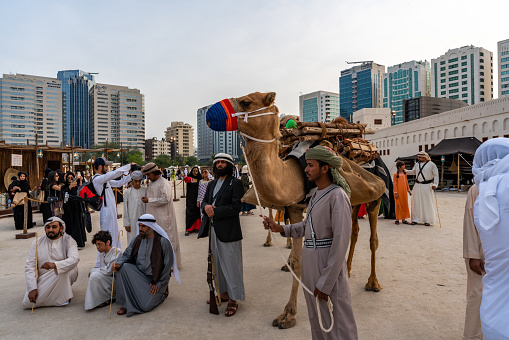 Arabic culture display - traditional cloth - Middle Eastern Culture - Emirati Men - tourist attraction activities\n- Abu Dhabi, UAE - December 23, 2019