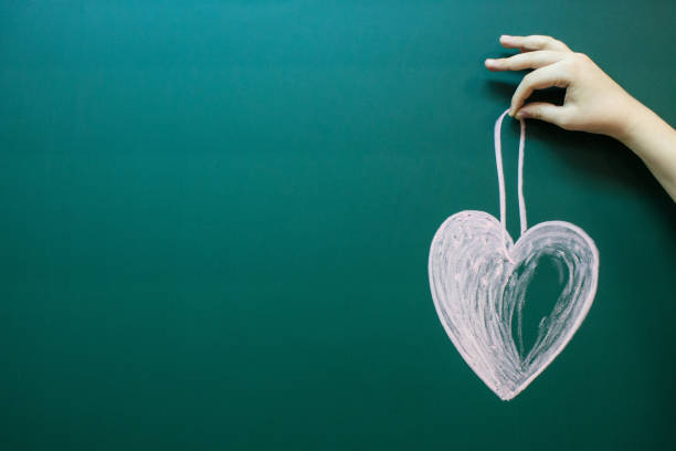 istock A heart drawn in white chalk 1196806514