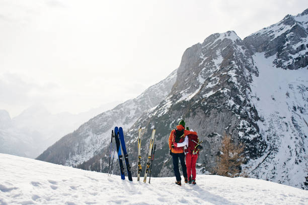 istock Young couple enjoying the view at the mountain 1196808884