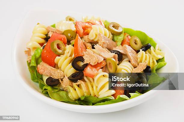 Plate With Tuna Pasta Tomato Lettuce And Olive Salad Stock Photo - Download Image Now