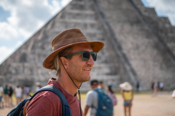 istock Young man exploring ancient archeological Mayan city in Mexico 1196810593