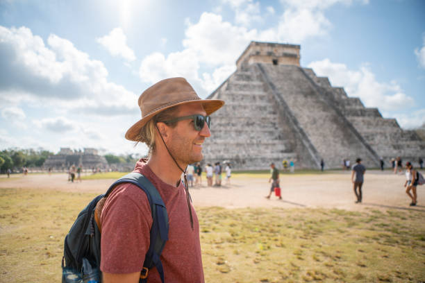 istock Young man exploring ancient archeological Mayan city in Mexico 1196810764