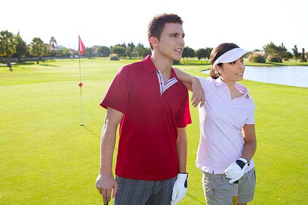 istock Golf course young players couple standing 119681174