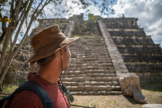 istock Young man exploring ancient archeological Mayan city in Mexico 1196812401