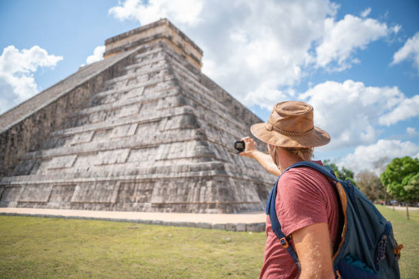 istock Tourist in Mexico photographing Mayan pyramid 1196813300