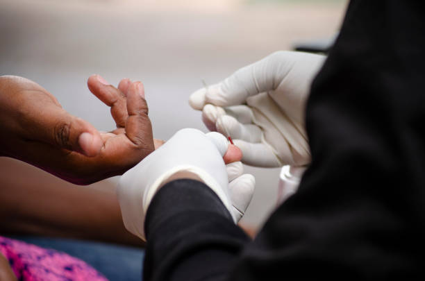 istock A nurse takes a blood sample for a test. 1196813315