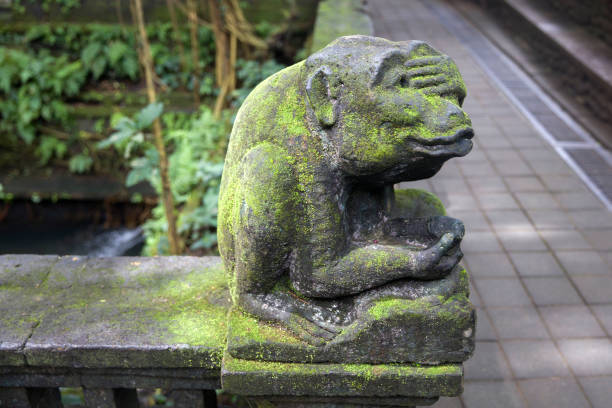 istock Statue of monkey at Ubud Monkey Forest sanctuary at Bali, Indonesia 1196813398
