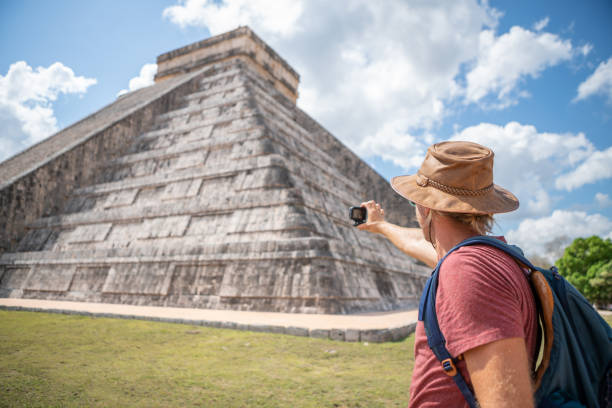 istock Tourist in Mexico photographing Mayan pyramid 1196813446