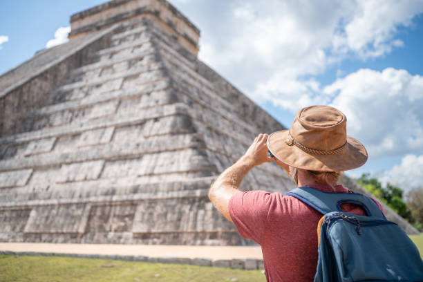 istock Tourist in Mexico photographing Mayan pyramid 1196814006