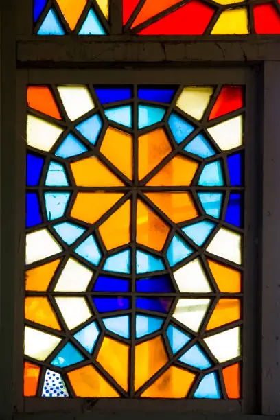 Closeup detail of the colorful stained glass window