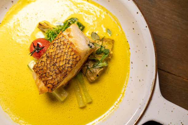 istock Seabass steak with cream soup in the white plate 1196814380