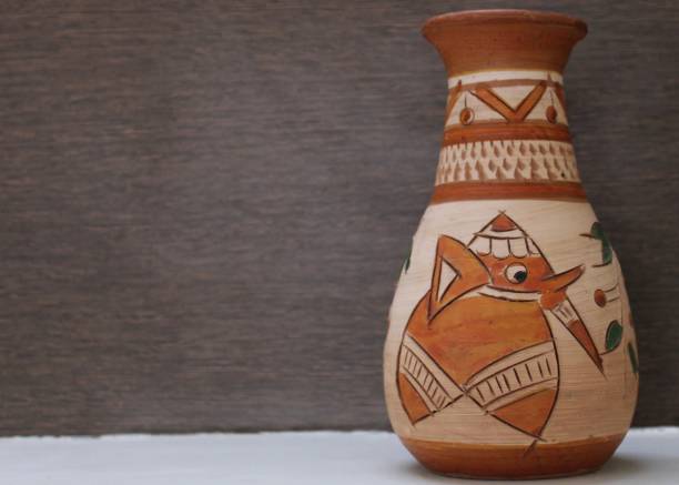 Two clay pots on the background of linen cloth with pleats close up