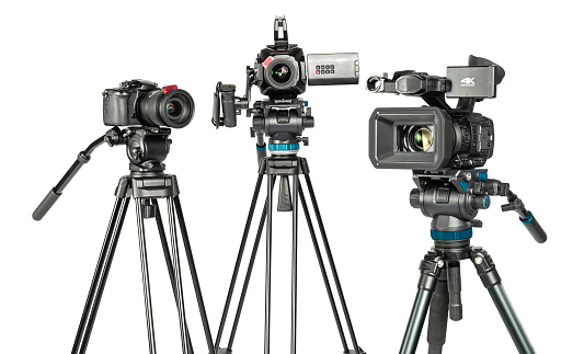 Three different types of professional video cinema photo camera on white background. The picture is taken with Sony A7III camera.