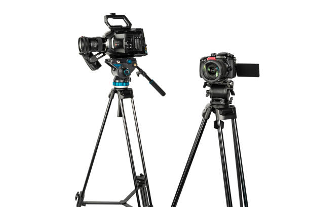 istock Two different types of professional video cinema broadcast camera on white background copy space 1196816023