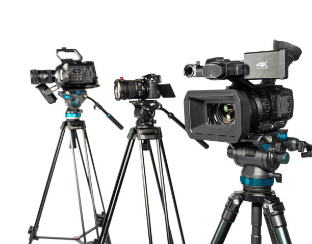 istock Three different types of professional video cinema photo camera on white background focus on foregroung 1196816082