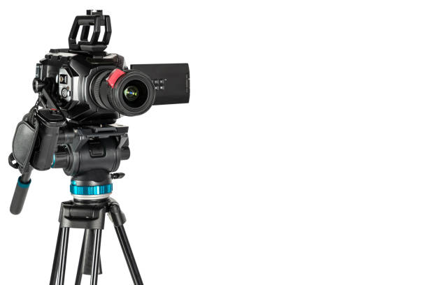 istock Professional video cinema camera on a camera tripod on white studio background copy space 1196816179