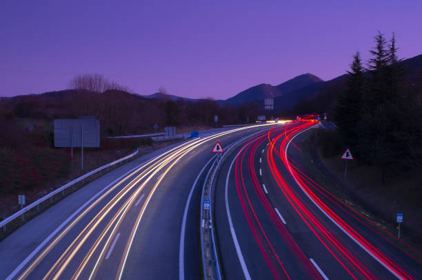 istock Car lights on the A15 highway, Navarra 1196816275