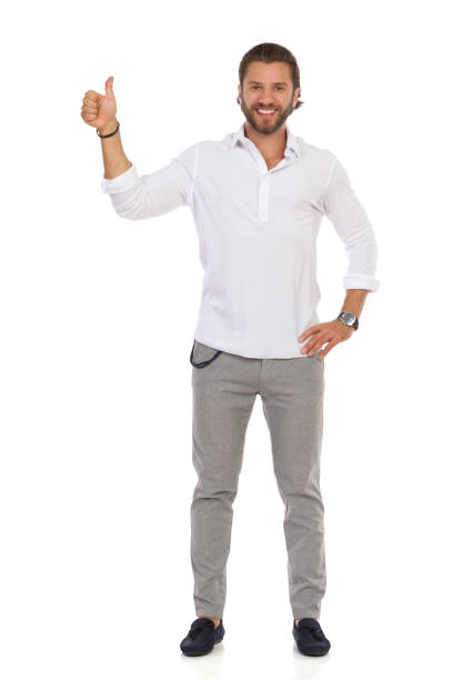 istock Handsome Elegant Man Is Standing And Showing Thumb Up 1196816894