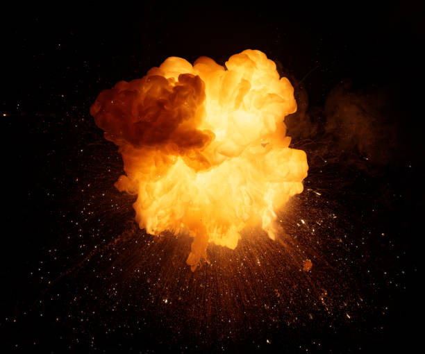 istock Realistic fiery bomb explosion with sparks and smoke isolated on black background 1196817797