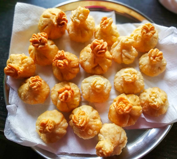 lord ganesha prasad modak w stalowej płycie - ganesh festival zdjęcia i obrazy z banku zdjęć