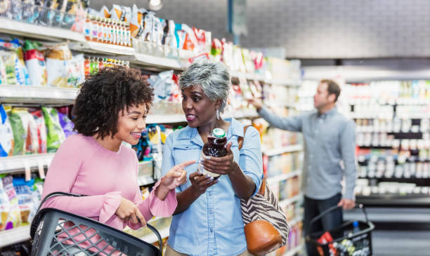 istock Two African-American women in supermarket 1196818607