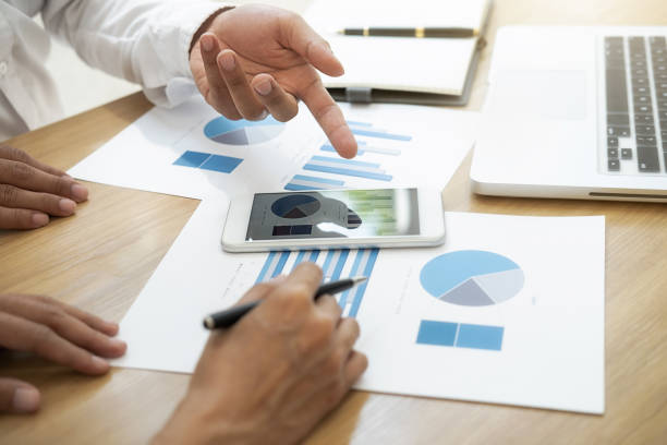 istock Business team brainstorming and discussing with financial data and report graph. Teamwork meeting working concept. 1196819800