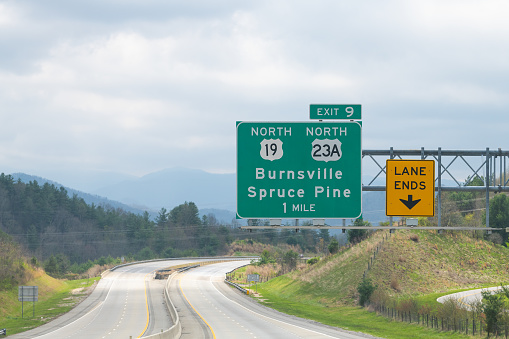 Smoky Mountains in North Carolina closeup on i26 highway road of exit sign for Burnsville Spruce Pine