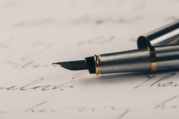 istock Fountain pen on an ancient handwritten letter. Old story. Retro style. 1196820540