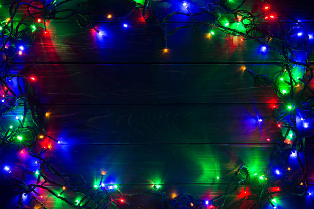 istock Christmas background with lights and free text space. Christmas lights. Glowing colorful Christmas lights . New Year. Garland. 1196820719