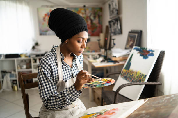 istock Beautiful fine art painter drawing in studio 1196822661