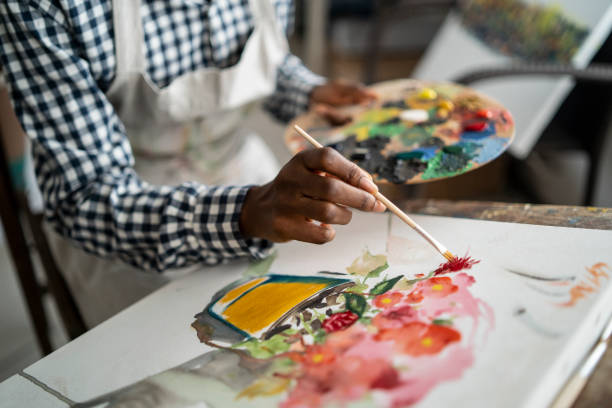 istock Female artist working in studio 1196822662
