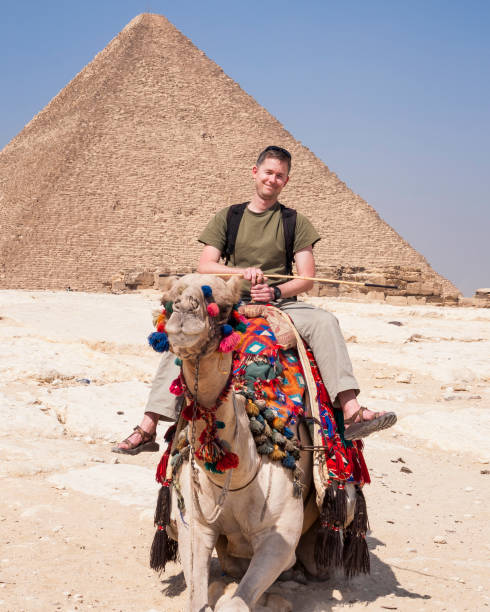 istock Finishing a camel ride at the Giza Pyramids 1196827545