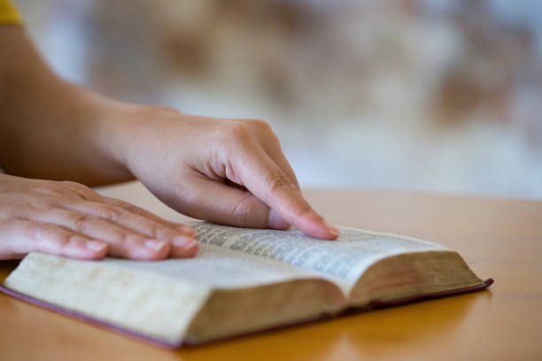 istock bible,women reading the Holy Bible 1196831900