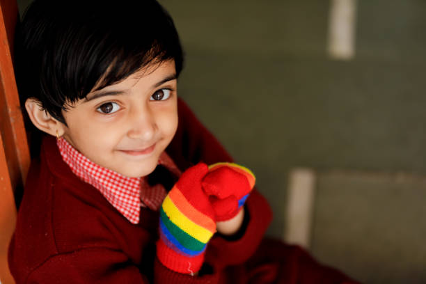 istock Indian little girl in school uniform and showing expression 1196832816
