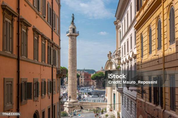 People Walking Next To The Trajans Column And Church Of The Most Holy Name Of Mary At The Trajan Forum In Rome City Italy Stock Photo - Download Image Now