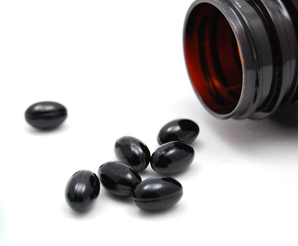 comprimido de vitamina cápsulas de medicina alternativa - gel pill fotografías e imágenes de stock