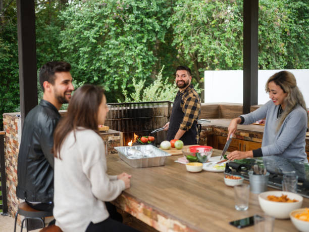 Friends cooking together a Mexican barbecue