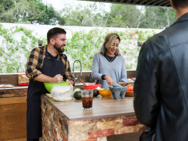 istock Happy friends cooking 1196836626