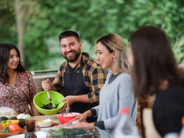 istock Friends cooking and having fun together 1196836631