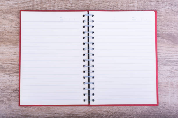 istock Top view of Open diary  or note book put on wooden table. 1196836758