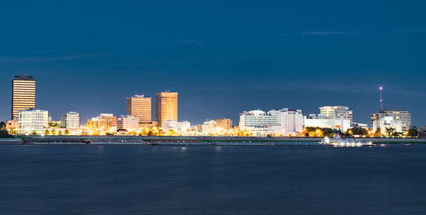 Night Skyline of Baton Rouge, Louisiana Night Skyline of Baton Rouge, Louisiana across the Mississippi River baton rouge stock pictures, royalty-free photos & images