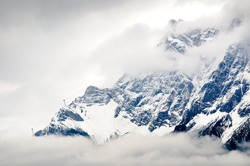 Cable car cable disappearing into the clouds on the Austrian side of the Zugspitze